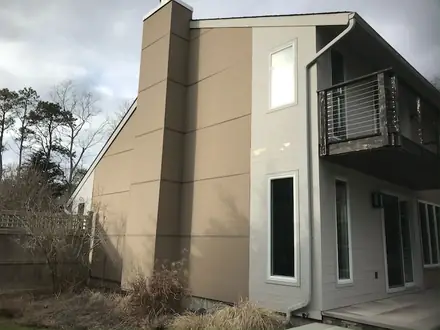 A second elevation of the Bello home before repainting