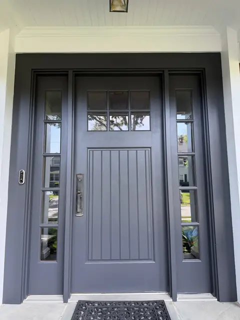 Front door with sidelights painted dark gray