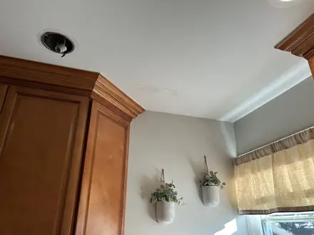 Kitchen ceiling with water staining before Walker Painting repainted it