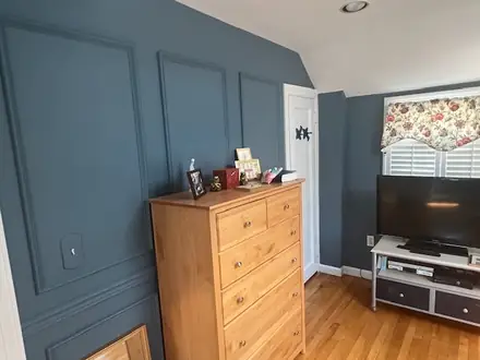 The finished home office in Benjamin Moore Philipsburg Blue with custom wall moulding