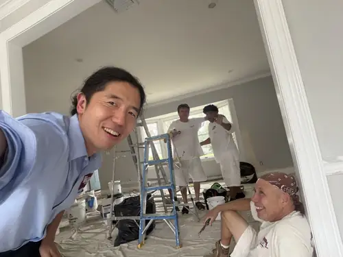 Walker Painting leadership on-site with the crew and a homeowner